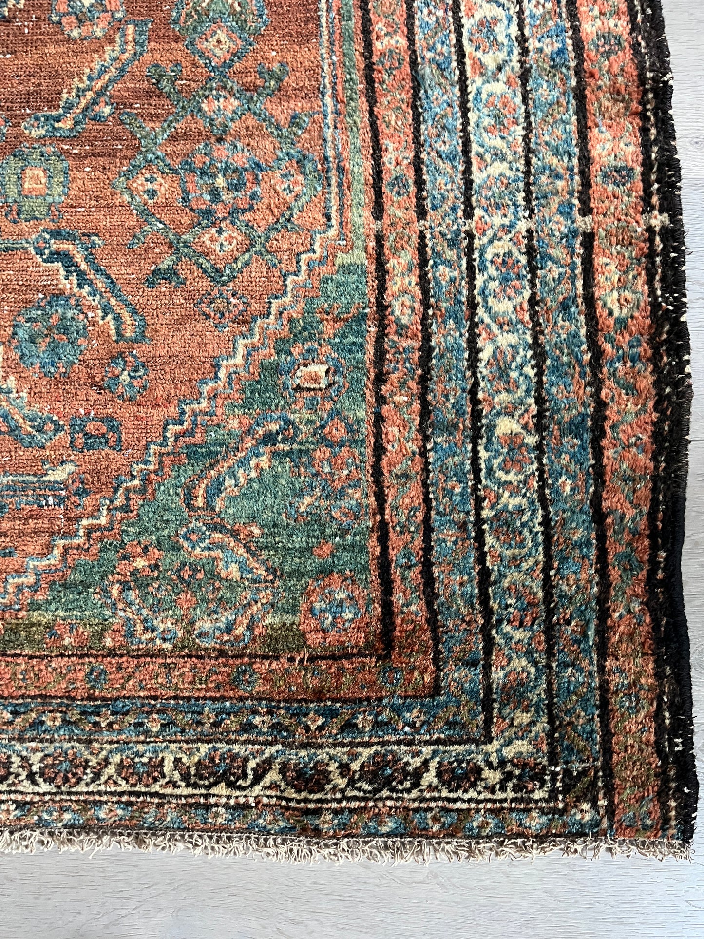 Antique Oriental Rug featuring the rich hues characteristic of renowned Heriz Serapi Rugs