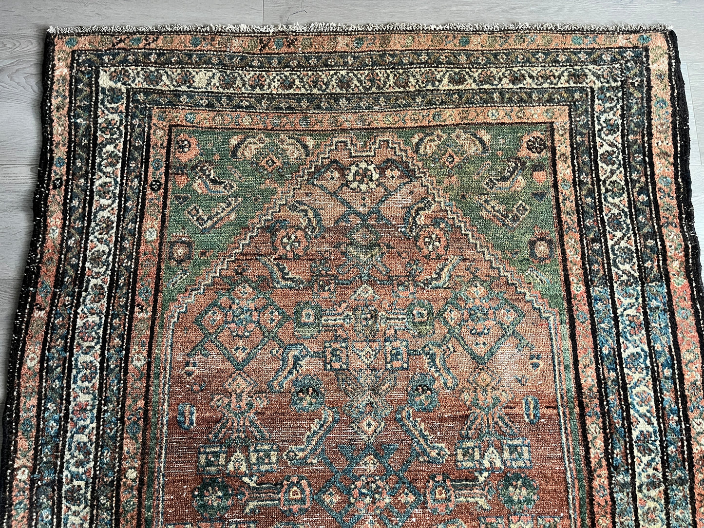 Antique Oriental Rug featuring the rich hues characteristic of renowned Heriz Serapi Rugs