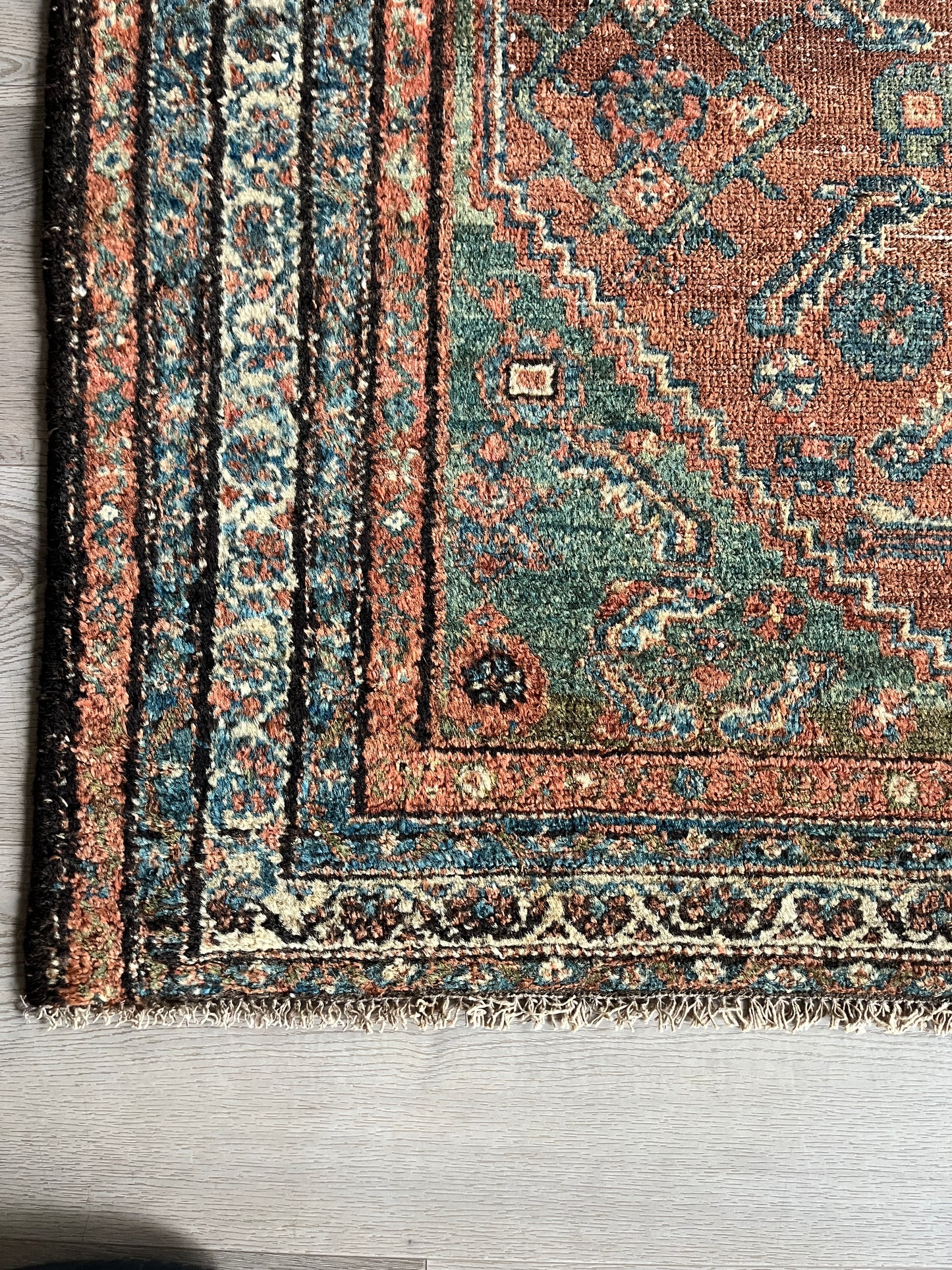 Antique Oriental Rug featuring the rich hues characteristic of renowned Heriz Serapi Rugs