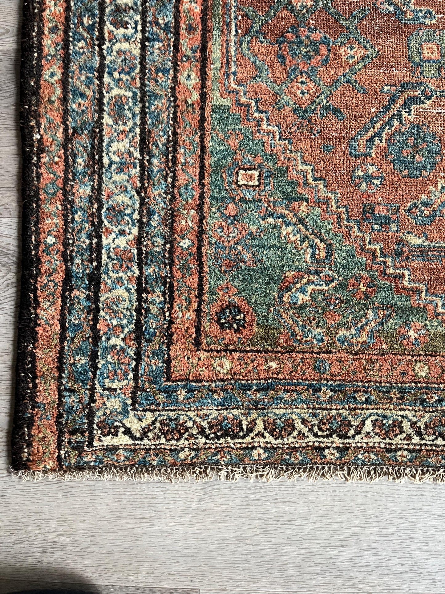 Antique Oriental Rug featuring the rich hues characteristic of renowned Heriz Serapi Rugs