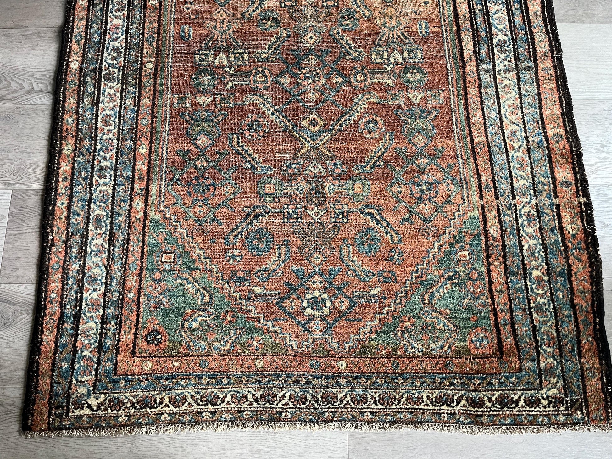 Antique Oriental Rug featuring the rich hues characteristic of renowned Heriz Serapi Rugs