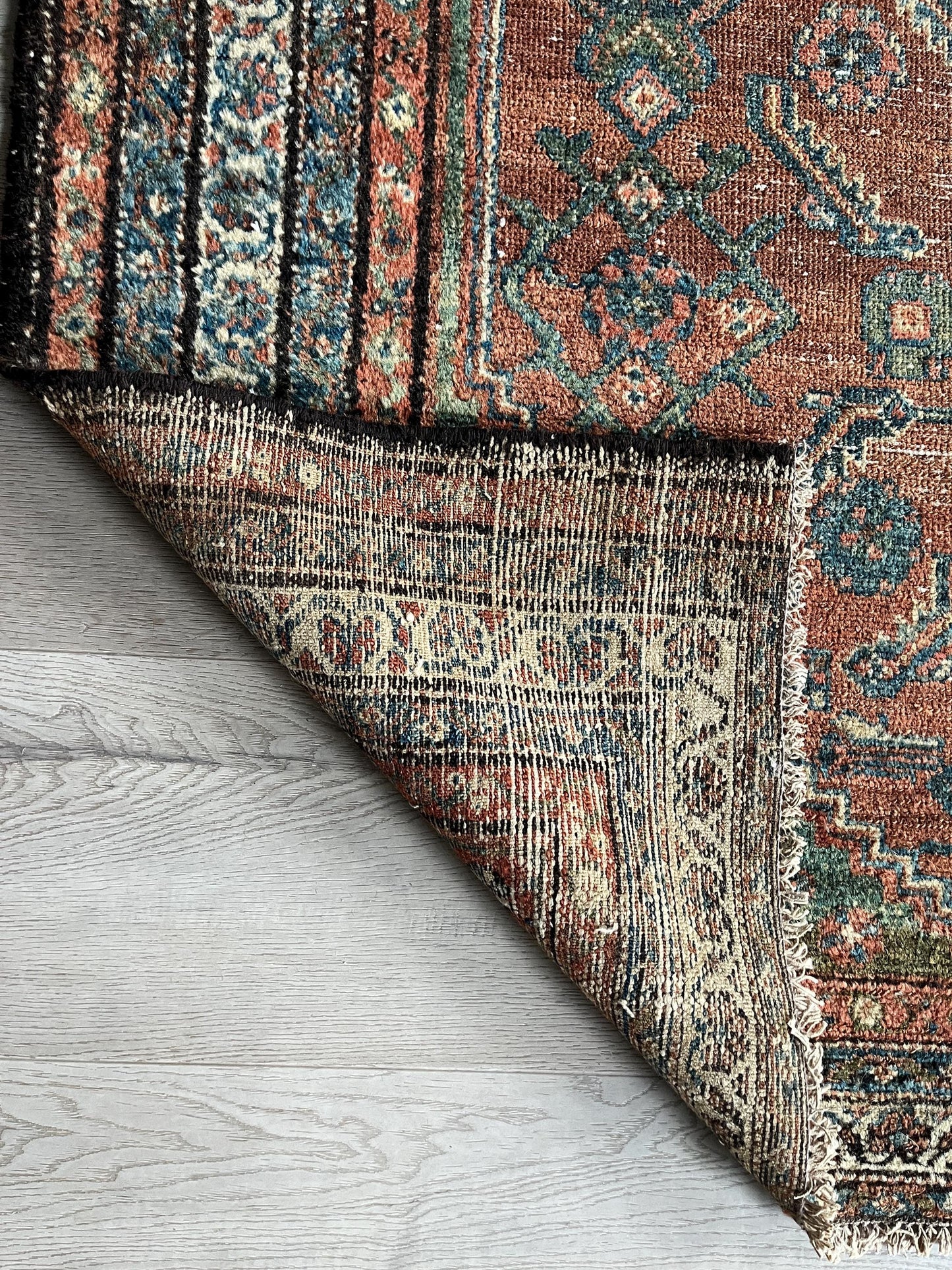 Antique Oriental Rug featuring the rich hues characteristic of renowned Heriz Serapi Rugs