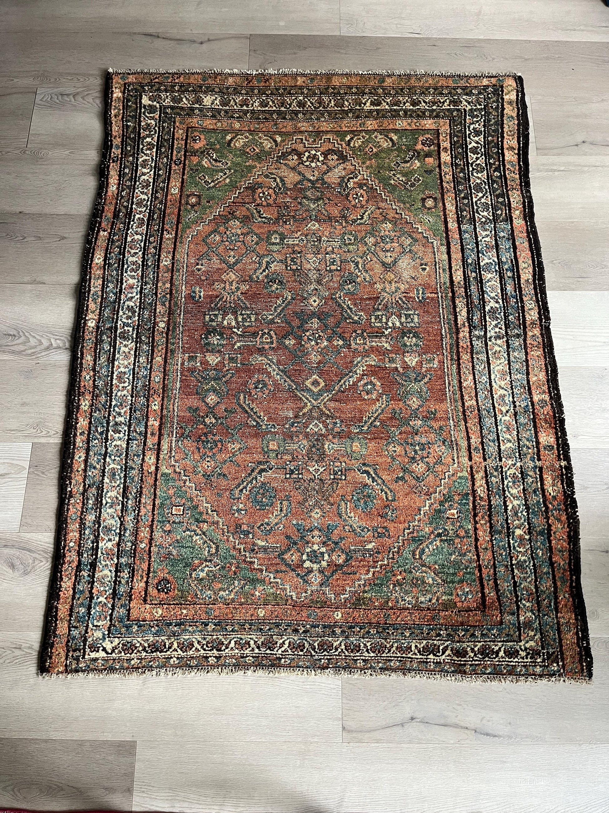 Antique Oriental Rug featuring the rich hues characteristic of renowned Heriz Serapi Rugs