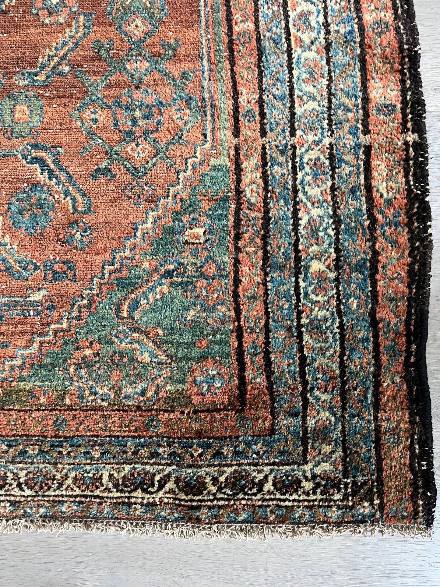 Antique Oriental Rug featuring the rich hues characteristic of renowned Heriz Serapi Rugs