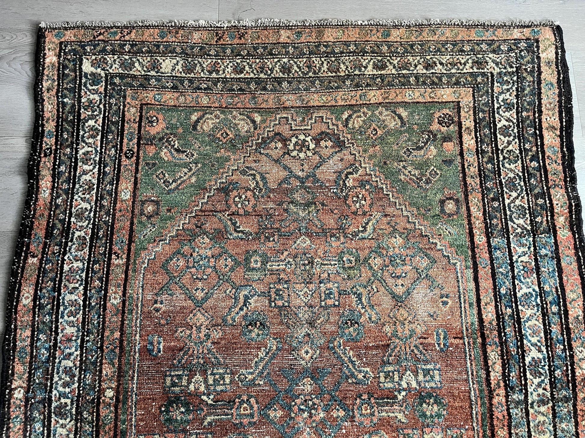 Antique Oriental Rug featuring the rich hues characteristic of renowned Heriz Serapi Rugs